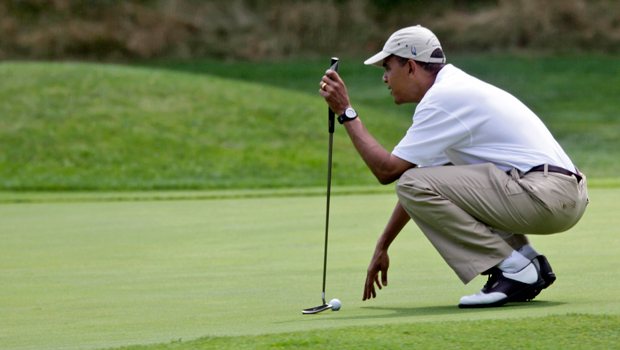 President Barack Obama lines up his putt at the Mink Meadows Golf Club on August 25, 2009 in Vineyard Haven, Massachusetts. Reporters recently became angry with President Obama when they were excluded from his round of golf with Tiger Woods. (AP/ Alex Brandon)