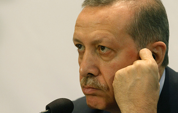 Turkish Prime Minister Recep Tayyip Erdogan listens at a press conference during the 5th Global Forum of the U.N. Alliance of Civilizations at the Hofburg palace in Vienna, Austria, Wednesday, February 27, 2013. (AP/Ronald Zak)