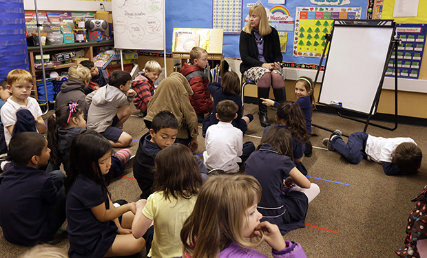 First grade teacher Lynda Jensen teaches her class of 30 children, Thursday, January 24, 2013, at the Willow Glenn Elementary School in San Jose, California. (AP/Ben Margot)