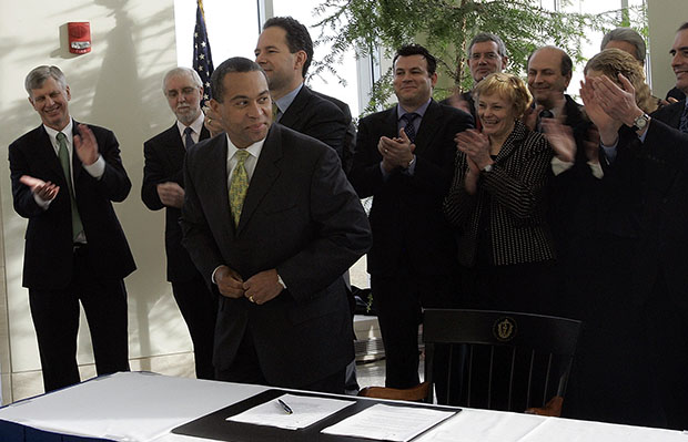 Massachusetts Gov. Deval Patrick (D), center, stands after signing the Regional Greenhouse Gas Initiative during a news conference at the University of Massachusetts Boston, Thursday, January 18, 2007, in Boston, where it was announced that Massachusetts will join the nation's first multistate program to reduce emissions of greenhouse gases that contribute to global warming. (AP/Chitose Suzuki)