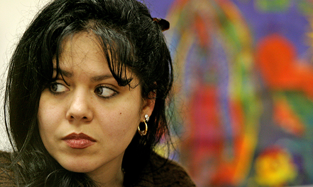 Yazmin Santiago, 29, listens to a question during an interview at the Latin American Community Center in Wilmington, Delaware. Santiago, a single mother of five children, relied on welfare for almost a decade after moving to Delaware from Puerto Rico in 1997. (AP/Ron Soliman)