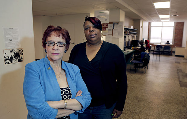 Evelyn Craig, left, executive director of reStart Inc., and LaTonya Jenkins, a reStart client who lives at the facility, pose at the homeless shelter in Kansas City, Missouri, March 19, 2013. The women are concerned that Missouri's refusal to expand Medicaid under the Affordable Care Act will harm residents of the shelter such as Jenkins. (AP/Charlie Riedel)