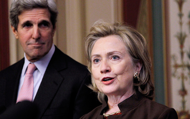 Then-Secretary of State Hillary Clinton, right, accompanied by then-Senate Foreign Relations Committee Chairman Sen. John Kerry (D-MA), left, talks about the START Treaty on Capitol Hill in Washington, November 17, 2010. (AP/Manuel Balce Ceneta)