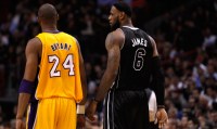Miami Heat's LeBron James speaks with Los Angeles Lakers' Kobe Bryant during a game on January 19, 2012. The media's stereotypical portrayals of race have obscured reality in sports. (AP/Lynne Sladky)