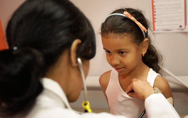 Brianny Abreu, 6, has her vitals checked at the William F. Ryan Community Health Center in New York, Wednesday, June 27, 2012. (AP/Seth Wenig)