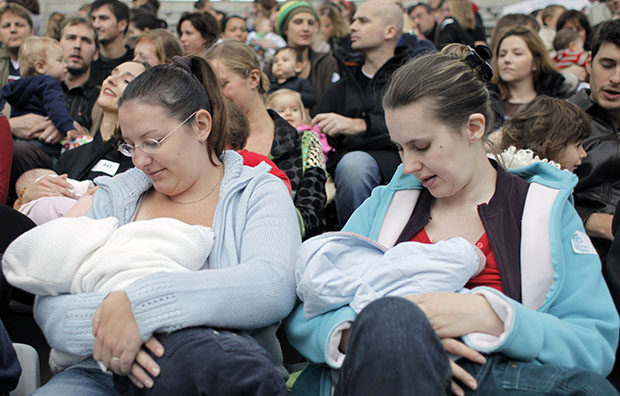 Mothers breastfeed their babies in Paris, France, Sunday, October 11, 2008, during a worldwide breastfeeding event. As part of the World Breastfeeding Week, many French women gathered in Paris, joining other women in other countries, in a bid to raise worldwide awareness of the benefits of breastfeeding babies. (AP/Thibault Camus)