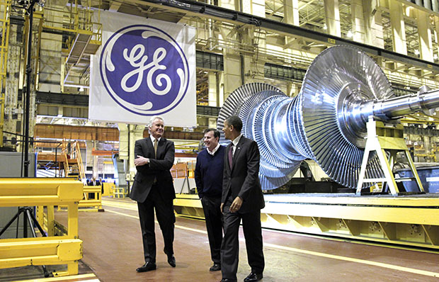 President Barack Obama, joined by General Electric CEO Jeffrey Immelt, left, and Plant Manager Kevin Sharkey, center, visits a GE plant in Schenectady, New York, to talk about clean energy and green jobs, Friday, January 21, 2011. (AP/J. Scott Applewhite)