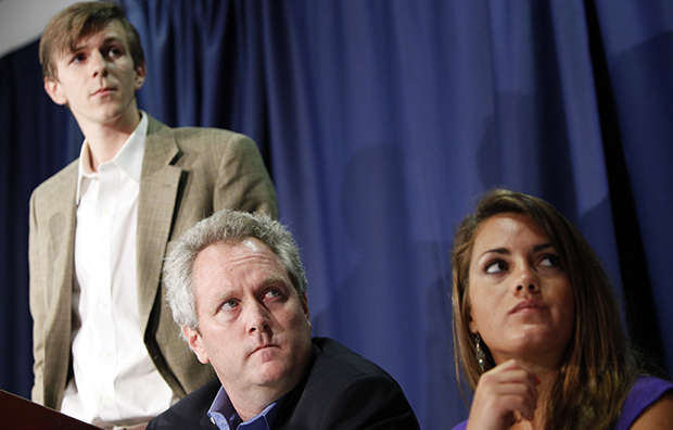 Andrew Breitbart, center, flanked by James O'Keefe III, left, and Hannah Giles, takes part in a news conference, Wednesday, October 21, 2009, at the National Press Club in Washington. (AP/Haraz N. Ghanbari)