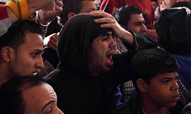 Families and supporters of those accused of soccer violence from the Port Said soccer club react to the announcement of verdicts for 21 fans on trial in last year's Port Said stadium incident which left 74 people dead, in Port Said, Egypt, Saturday, January 26, 2013. (AP/Mohammed Nouhan)