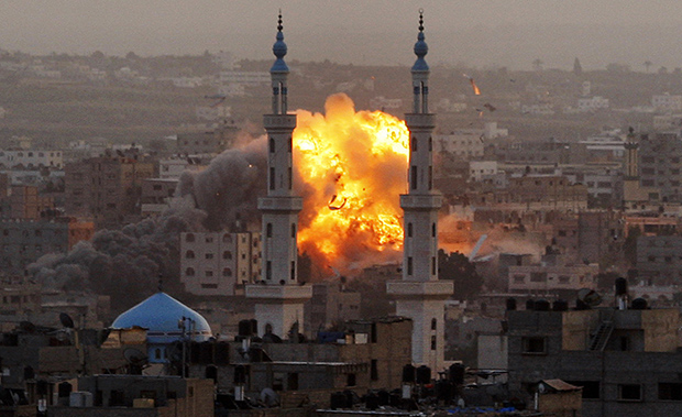 In this November 17, 2012, file photo, smoke rises during an explosion from an Israeli strike in Gaza City. When violence flared up in the Gaza Strip last November, Egypt, Israel, and the United States worked behind the scenes to arrange a ceasefire and prevent a wider conflict. (AP/Hatem Moussa)