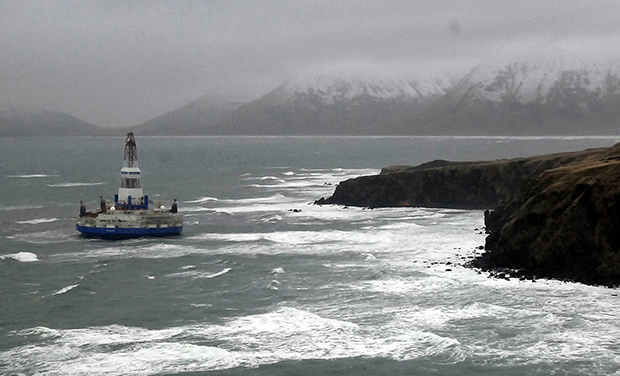 This image provided by the U.S. Coast Guard shows the Royal Dutch Shell drilling rig Kulluk aground off a small island near Kodiak Island, Wednesday, January 2, 2013. (AP/U.S. Coast Guard)