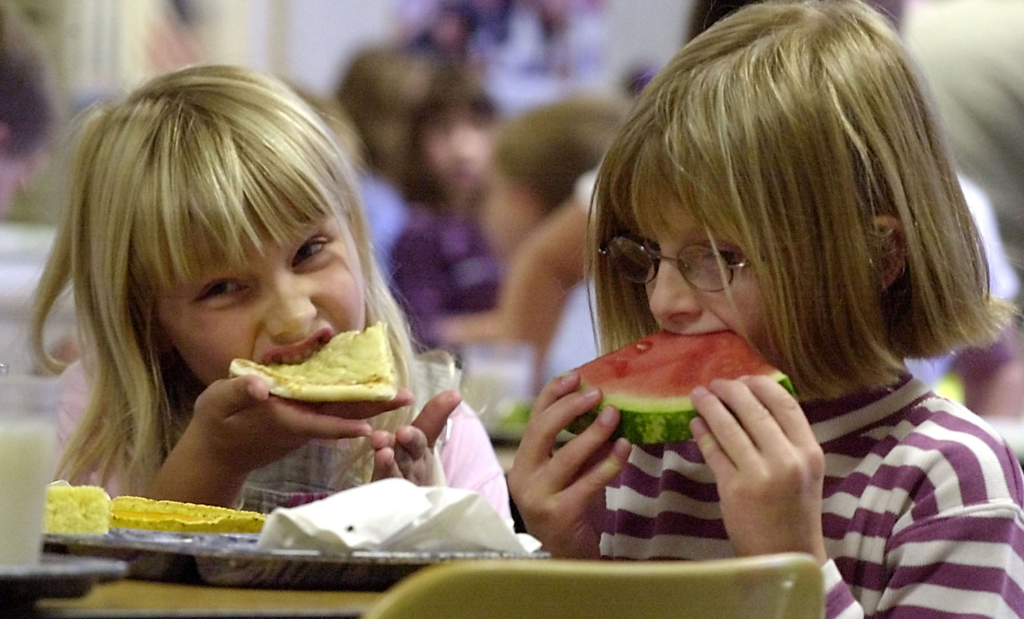 Two elementary school students enjoy lunch at the Thatcher Brook Elementary School in Waterbury, Vermont. The U.S. Department of Agriculture often partners with local groups to make sure children from low-income families get enough to eat. (AP/Toby Talbot)