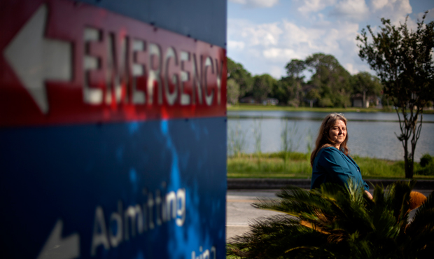 Kathleen Watson is photographed outside Shands Lake Shore Hospital, where she receives her cancer treatment and also picks up patients for her medical transport company, Monday, May 14, 2012, in Lake City, Florida. (AP/David Goldman)