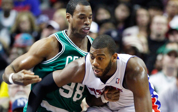 Then-Boston Celtics center Jason Collins, left, guards Detroit Pistons center Greg Monroe, right, in the second half of an NBA game in Auburn Hills, Michigan. (AP/Duane Burleson)