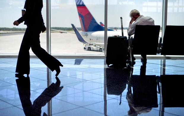 A passenger sits in the international terminal at Hartsfield-Jackson Atlanta International Airport, Friday, April 26, 2013. (AP/David Goldman)