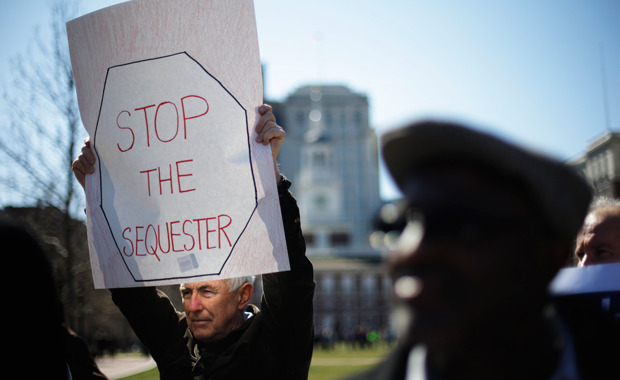 Government workers, supporting union members and activists, protest against the across-the-board federal spending cuts called sequestration at Independence National Historical Park, Wednesday, March 20, 2013, in Philadelphia. (AP/Matt Rourke)