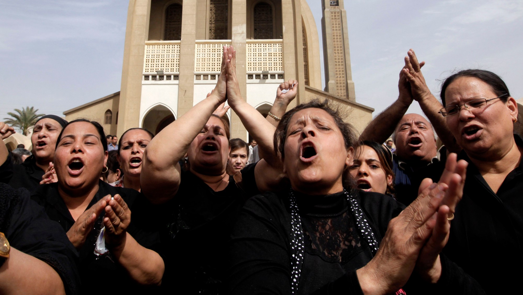 Egyptian chant anti-Muslim Brotherhood slogans following a funeral service at the Saint Mark Coptic cathedral in Cairo, Egypt, Sunday, April 7, 2013. Egyptian President Mohammed Morsi has failed to address the Muslim Brotherhood's denial of women's basic rights. (AP/ Amr Nabil)