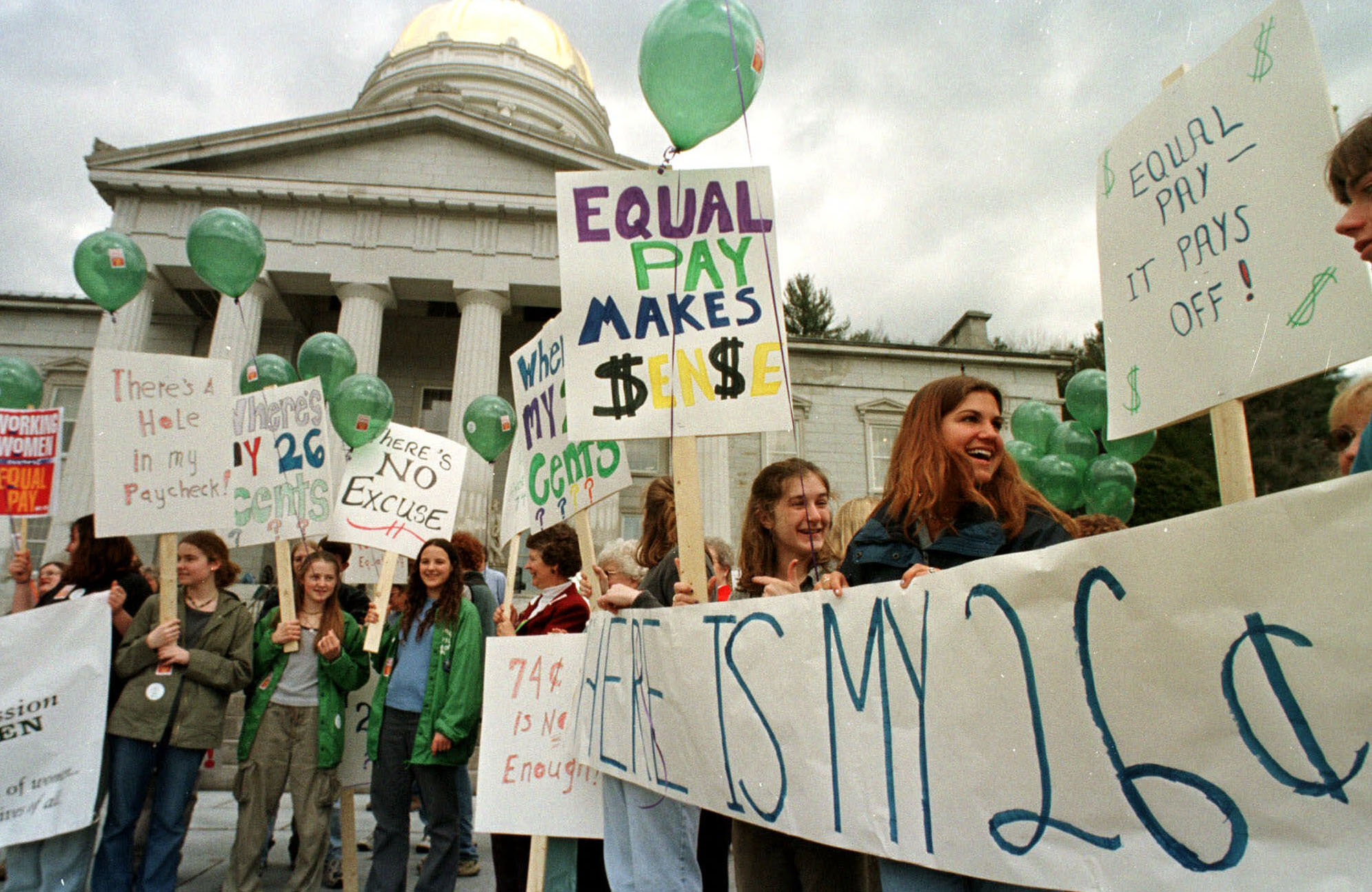 People gather on the steps of the statehouse in Vermont for a rally on National Equal Pay Day. Recent surveys show that women earn more than men in only 7 out of 500 professions. (AP/Toby Talbot)
