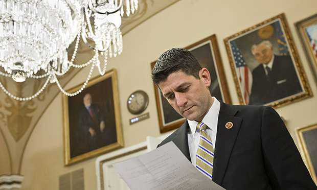 House Budget Committee Chairman Paul Ryan (R-WI) checks notes as he appears before the House Rules Committee to advance his party's FY 2014 budget proposal, at the Capitol in Washington, Monday, March 18, 2013. (AP/J. Scott Applewhite)