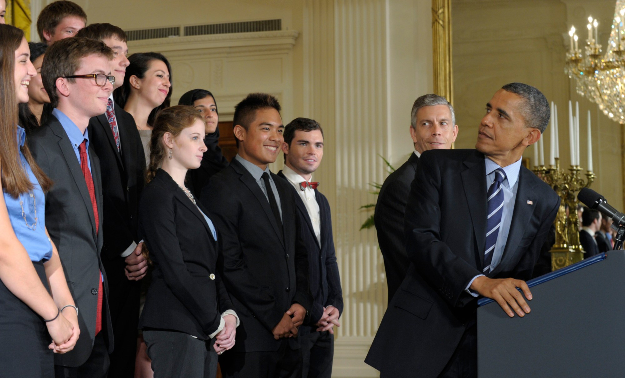 In this June 2012 picture, President Barack Obama looks back at students as he calls on Congress to stop interest rates on student loans from doubling. One year later, Congress must again act to keep rates low. (AP/Susan Walsh)