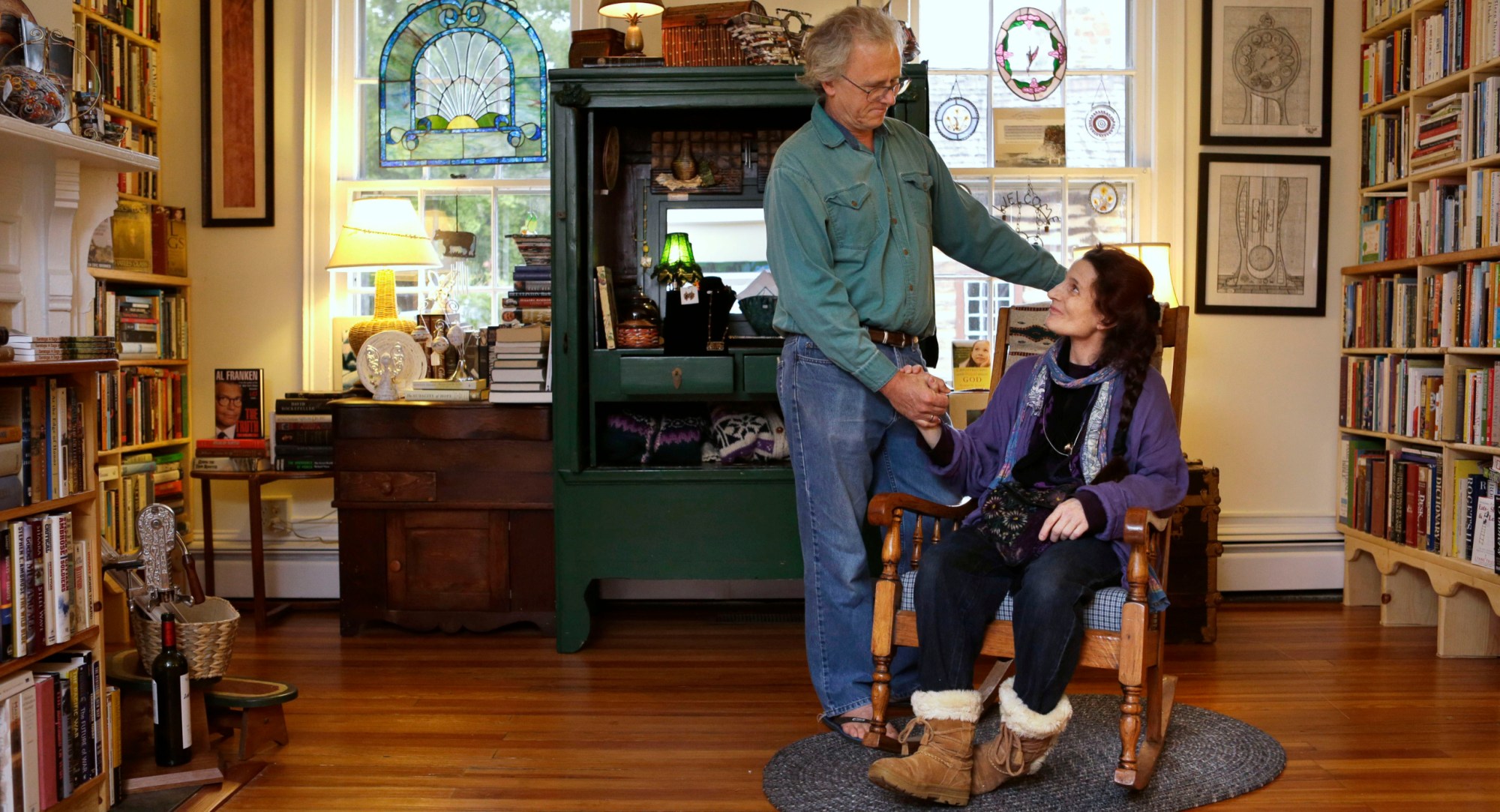 Allen Robinson and his wife Nancy King Robinson pose for a portrait in their store, Books and Other Found Things, in Leesburg, Virginia. King Robinson, who has multiple sclerosis, receives Social Security disability. (AP/Jacquelyn Martin)