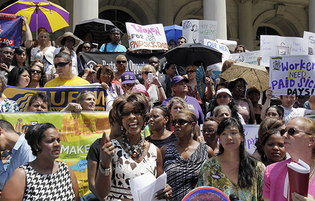 Marjorie Hill, second on the left, CEO of the Gay Men's Health Crisis, addresses the Women for Paid Sick Days rally on the steps of New York's City Hall, Wednesday, July 18, 2012. (AP/Richard Drew)