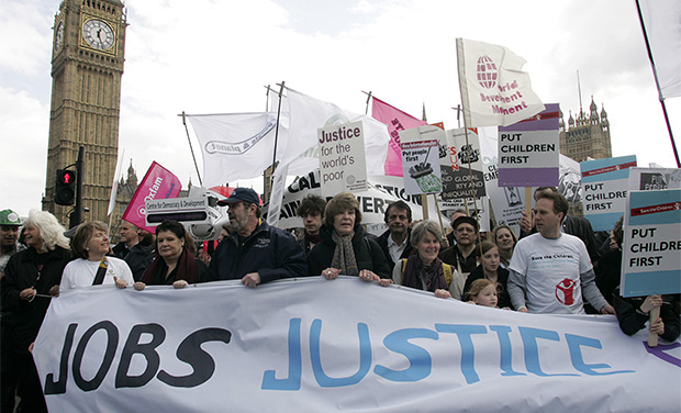 Demonstrators march in central London, Saturday, March 28, 2009. (AP/Akira Suemori)