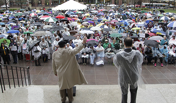 Demonstrators gather outside the Ohio Statehouse during a rally urging state lawmakers to extend Medicaid coverage under the Affordable Care Act, Thursday, April 11, 2013, in Columbus, Ohio. (AP/Jay LaPrete)