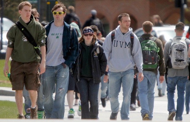 Students walk across campus at the University of Vermont, where students report working multiple jobs and studying full time as they accumulate student-loan debt. (AP/Toby Talbot)