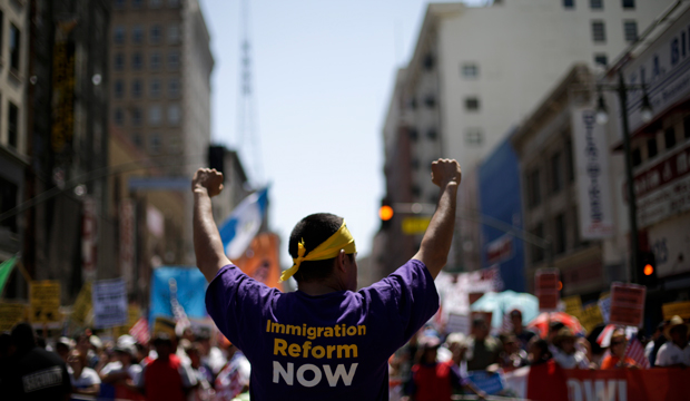 Marchers walk along during a rally for immigration reform in downtown Los Angeles, Wednesday, May 1, 2013. (AP/Jae C. Hong)
