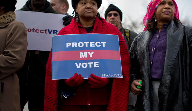 People wait in line outside the Supreme Court in Washington, Wednesday, February 27, 2013, to listen to oral arguments in the Shelby County v. Holder voting-rights case. (AP/Evan Vucci)