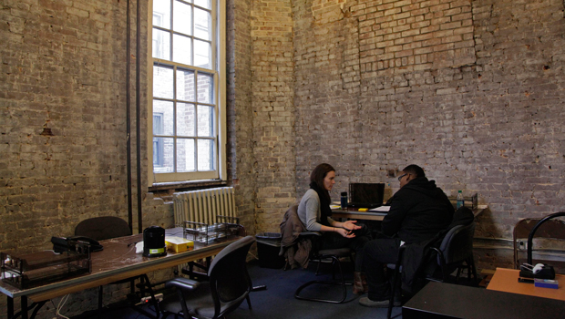 Megan Wakerley, left, case manager at the Ali Forney Center, relocated inside the Lesbian, Gay, Bisexual, and Transgender Center because of Superstorm Sandy, conducts an interview in New York, Wednesday, November 14, 2012. (AP/Richard Drew)