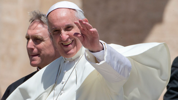 Pope Francis waves as he leaves St. Peter's Square at the Vatican after his weekly general audience on Wednesday, June 12, 2013. (AP/Alessandra Tarantino)