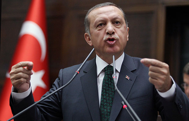 Turkish Prime Minister Recep Tayyip Erdoğan addresses his supporters and lawmakers at the parliament in Ankara, Turkey, Tuesday, June 25, 2013. (AP Photo)