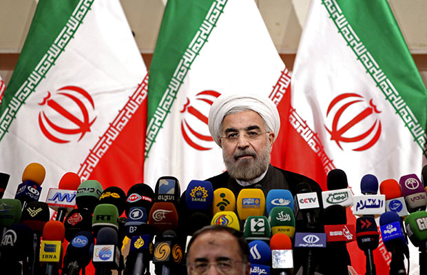 Newly elected Iranian President Hassan Rowhani listens during a press conference in Tehran, Iran, Monday, June 17, 2013. (AP/Ebrahim Noroozi)