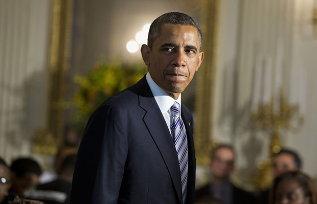 President Barack Obama arrives in the State Dining Room of the White House in Washington, Friday, June 14, 2013, where he hosted a Father's Day luncheon. Speaking about Syria, the president said its use of chemical weapons crosses a