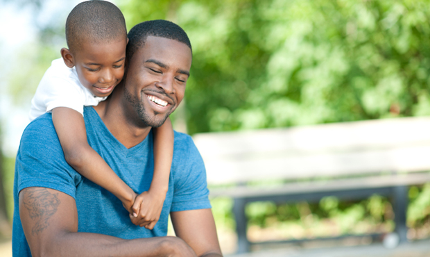 A father plays with his son. (iStockphoto)