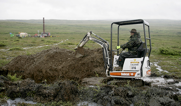A worker with the Pebble Mine project test drills in the Bristol Bay region of Alaska near the village of Iliamma, Alaska. (AP/Al Grillo)