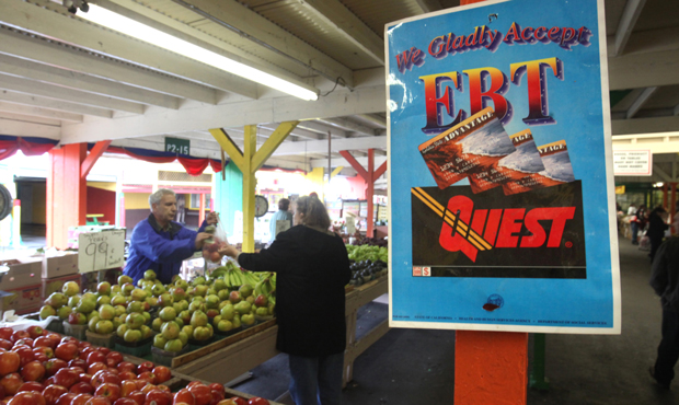 This February 6, 2010 file photo shows a sign announcing the acceptance of Electronic Benefit Transfer cards at a farmers market in Roseville, California. (AP/Rich Pedroncelli)