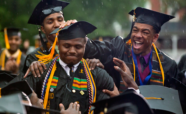 Graduate Leland Shelton is congratulated as he is acknowledged by President Barack Obama during his 129th commencement ceremony address at Morehouse College on Sunday, May 19, 2013 in Atlanta, Georgia. (AP/Carolyn Kaster)