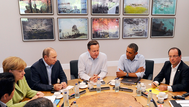 G-8 leaders from left, Japan's Prime Minister Shinzo Abe, German Chancellor Angela Merkel, Russian President Vladimir Putin, Britain's Prime Minister David Cameron, U.S. President Barack Obama, and French President Francois Hollande attend a working session during the G-8 summit at the Lough Erne golf resort in Enniskillen, Northern Ireland, Tuesday, June 18, 2013. (AP/Jewel Samad, Pool)