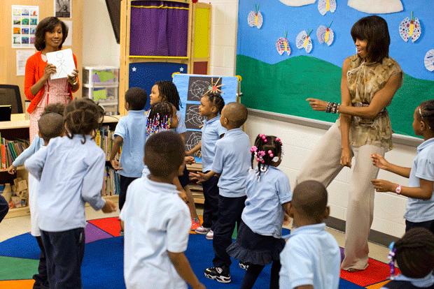 First lady Michelle Obama dances with a preschool class at Savoy Elementary School in Washington. The Savoy School was one of eight schools selected last year for the Turnaround Arts Initiative, which aims to improve low-performing schools. (AP/Evan Vucci)