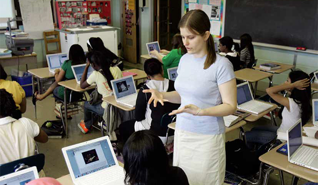 English teacher Allison Levine helps a student during class at Philadelphia High School for Girls. (AP/Matt Rourke)