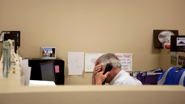 In this February 15, 2012 photo, Steve Wyard, 61, a regional sales director at All Valley Washer Service, talks on the phone in his office in Los Angeles. (AP/Jae C. Hong)