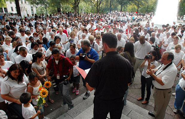 Participants bow their heads in prayer during a demonstration to protest Alabama's new law against illegal immigration in Birmingham, Alabama, June 25, 2011. (AP/Jay Reeves)