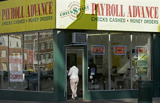 A customer enters a Payroll Advance location, Thursday, November 6, 2008, in Cincinnati, Ohio. (AP/Al Behrman)