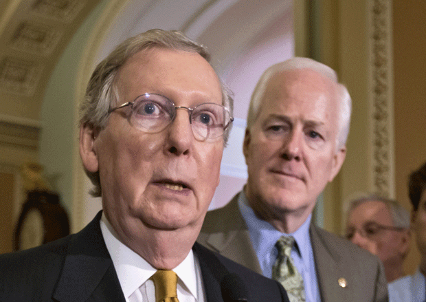 Senate Minority Leader Mitch McConnell (R-KY), accompanied by Senate Minority Whip John Cornyn (R-TX), speaks on Capitol Hill in Washington. (AP/J. Scott Applewhite)