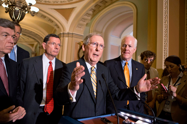 Senate Minority Leader Mitch McConnell (R-KY), accompanied by GOP leaders, talk to reporters on Capitol Hill after defeating a $54 billion funding bill for transportation, housing, and community development grants because it exceeded the punishing spending limits required under automatic budget cuts. (AP/J. Scott Applewhite)