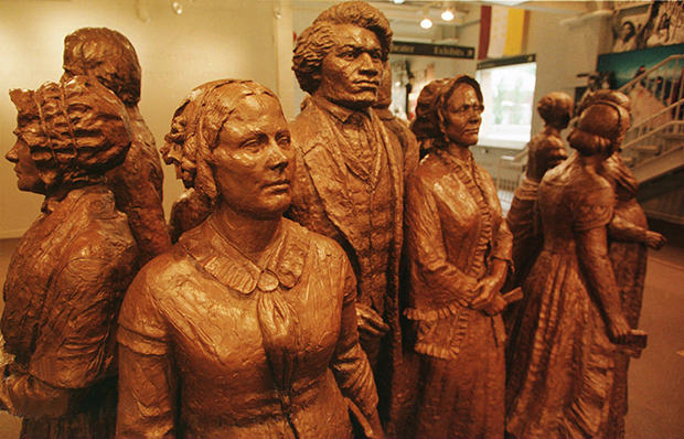 Shown in a June 2, 1995, photo, a group of life-size bronze statues is the iconic, signature piece of art at the Women's Rights National Historical Park in Seneca Falls, New York. The statues depict Elizabeth Cady Stanton, Frederick Douglass, Lucretia Mott, and other attendees at the Seneca Falls Convention of 1848. (AP/Michael Okoniewski)