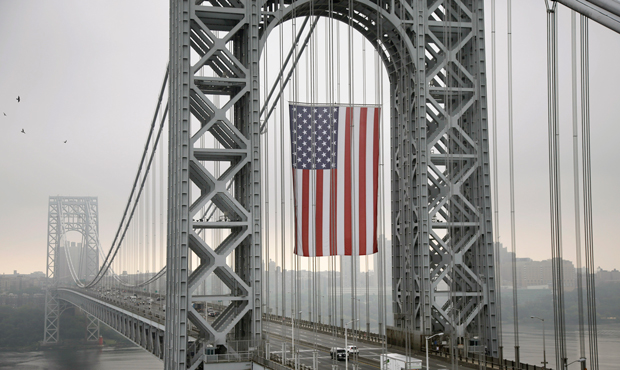 The largest free-flying American flag in the world flies over the George Washington Bridge, Monday, September 2, 2013 in Fort Lee, New Jersey, honoring the working men and women across the country. (AP/Mel Evans)
